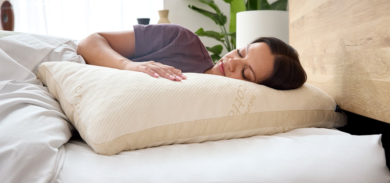 person sleeping on naturepedic adjustable organic latex pillow