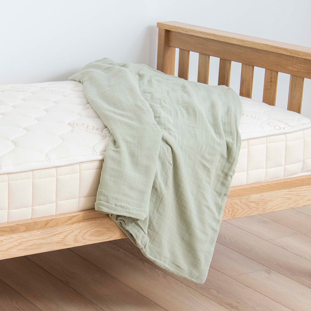 Muslin duvet draped over kids bed