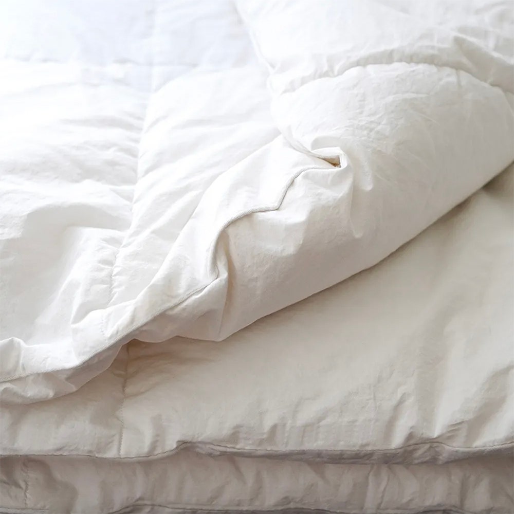 Down duvet insert with corner folded up