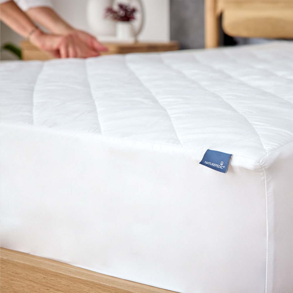 Quilted Organic Mattress Pad Protector on bed