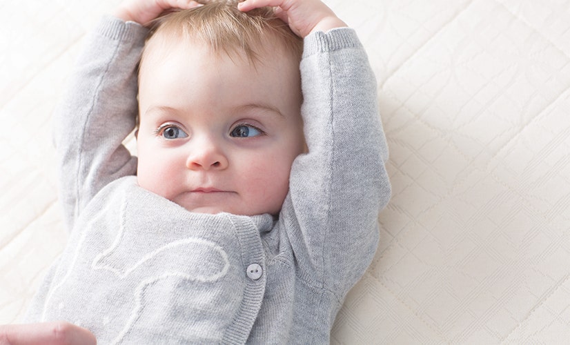 Baby laying on Breathable Ultra crib mattress